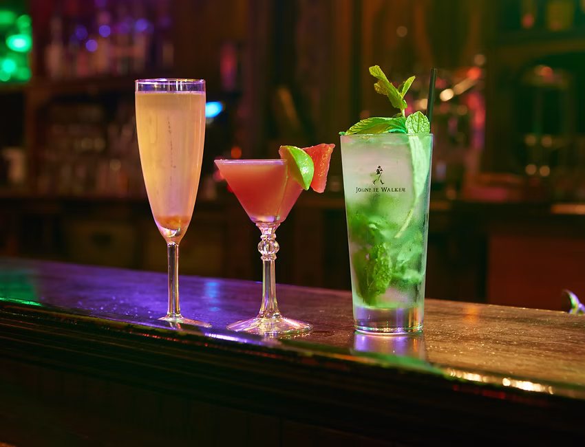 Elegant cocktails under bar lighting